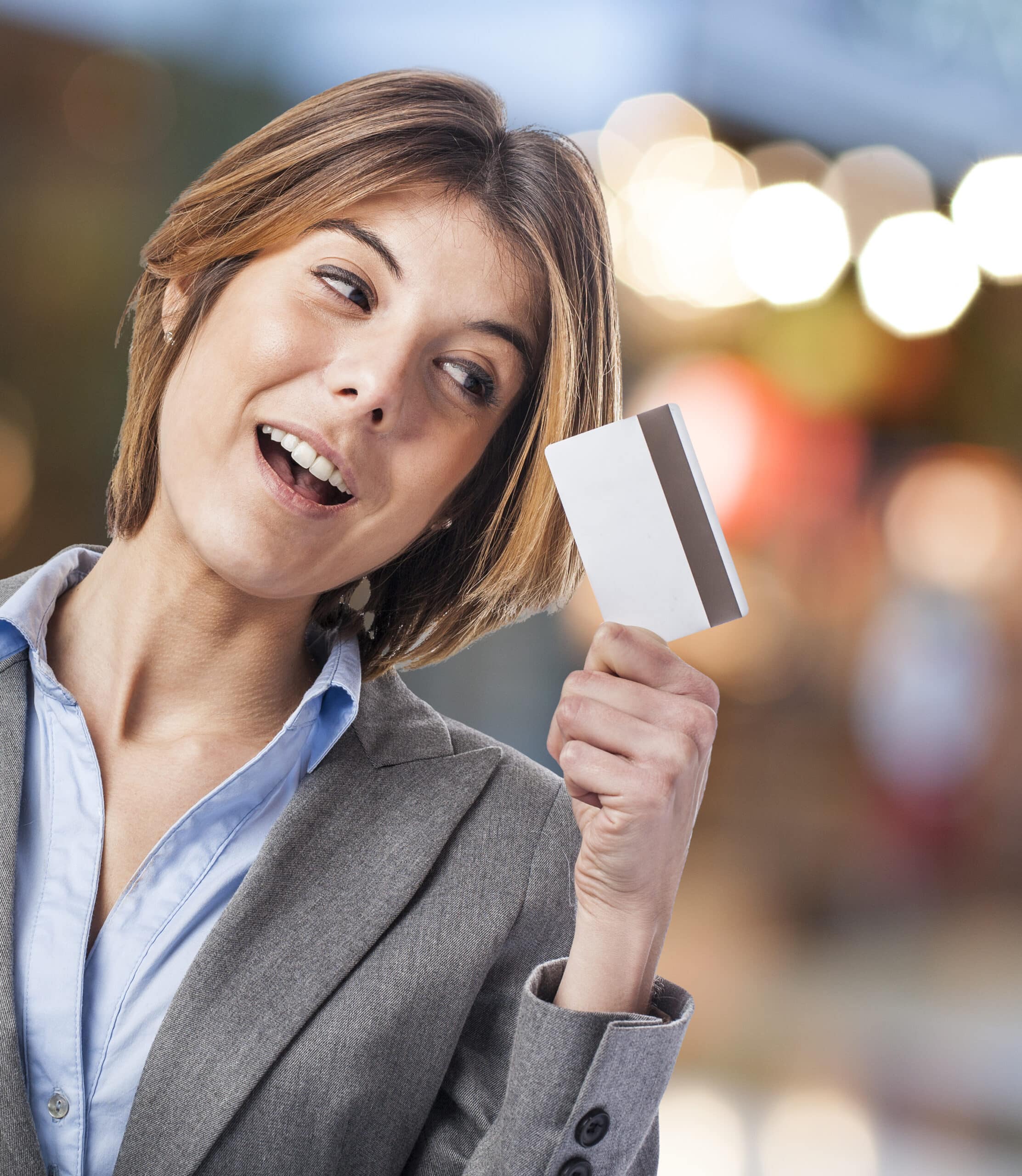 portrait of an executive young woman looking her credit card